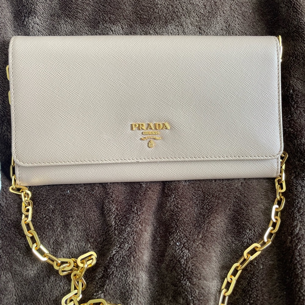 Prada Saffiano leather wallet on removable chain in nude and gold